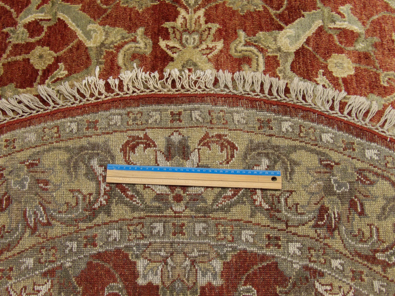 Gold and rust Jaipur Kashan round rug in room setting