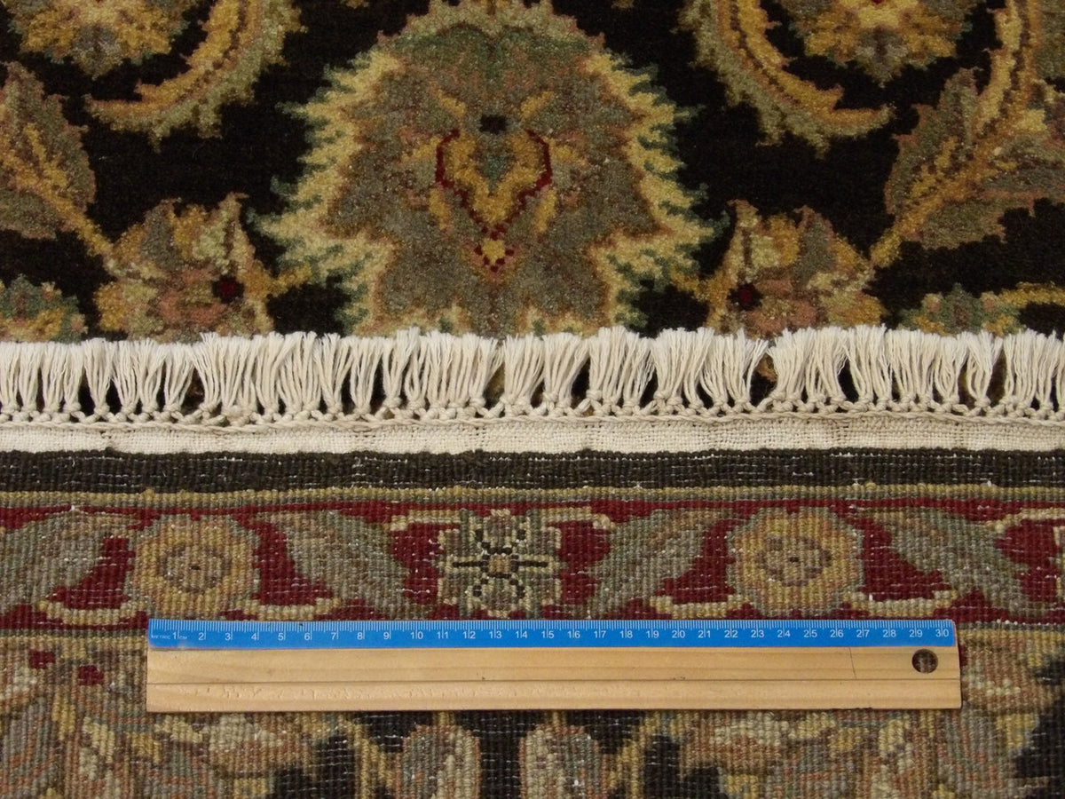 Green and red Jaipur Kashan runner in hallway setting