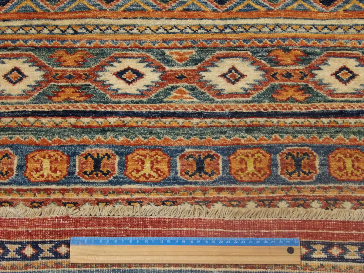 Blue and red Khorjin runner in hallway setting