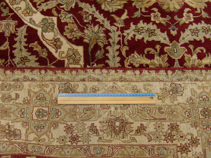 Beige & Red Fine Persian Haji Jalili rug in room setting