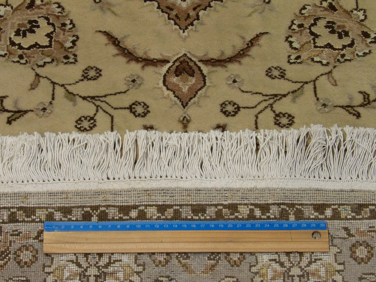 Brown & Green Fine Persian Tabriz rug in room setting