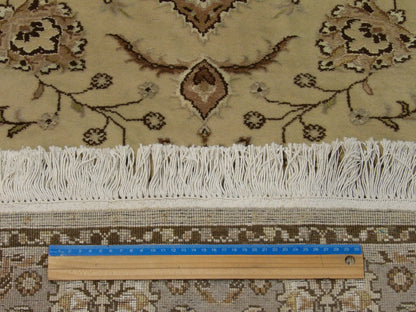 Brown & Green Fine Persian Tabriz rug in room setting