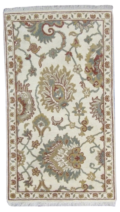 Oushak hand-knotted wool rug in Ivory, full view