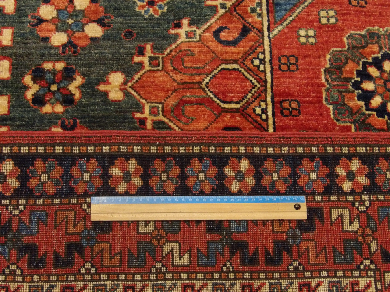Blue & Red Tribal Khorjan Natural Dye rug in room setting