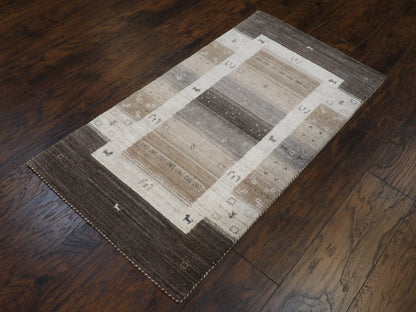 Gabbeh tribal motif detail, gray and white rug
