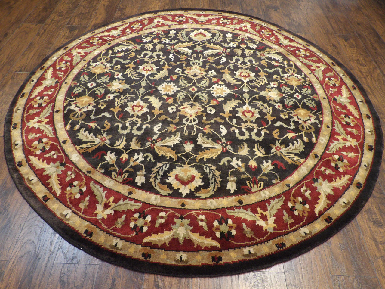 Close-up of wool pile, black and red round rug