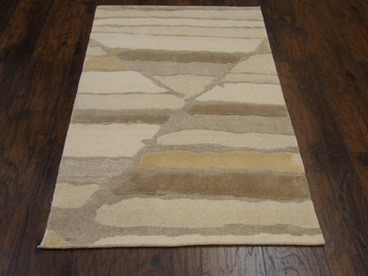 Close-up of wool-silk pile, gold and beige rug