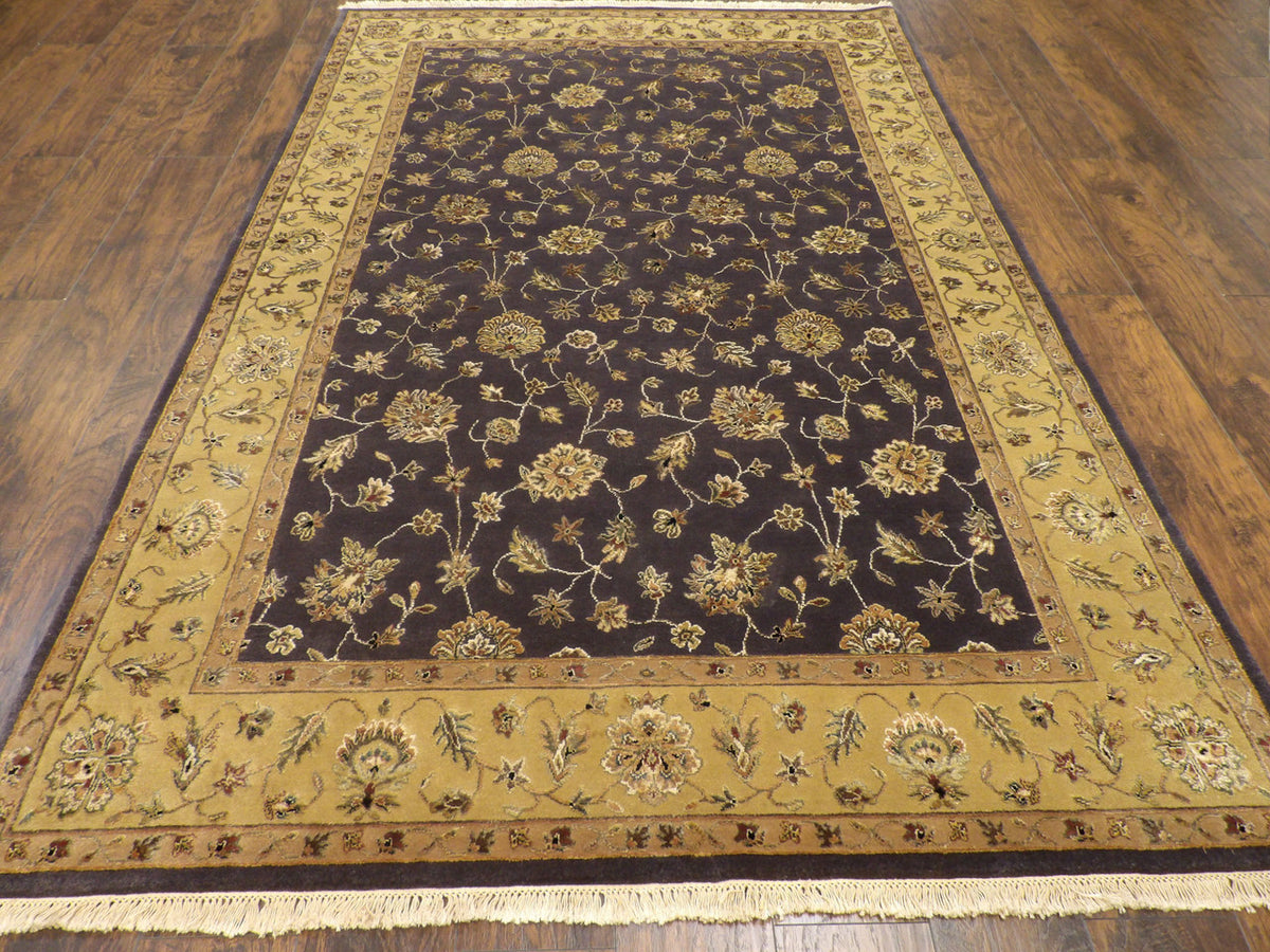 Close-up of wool-silk pile, gold and purple rug