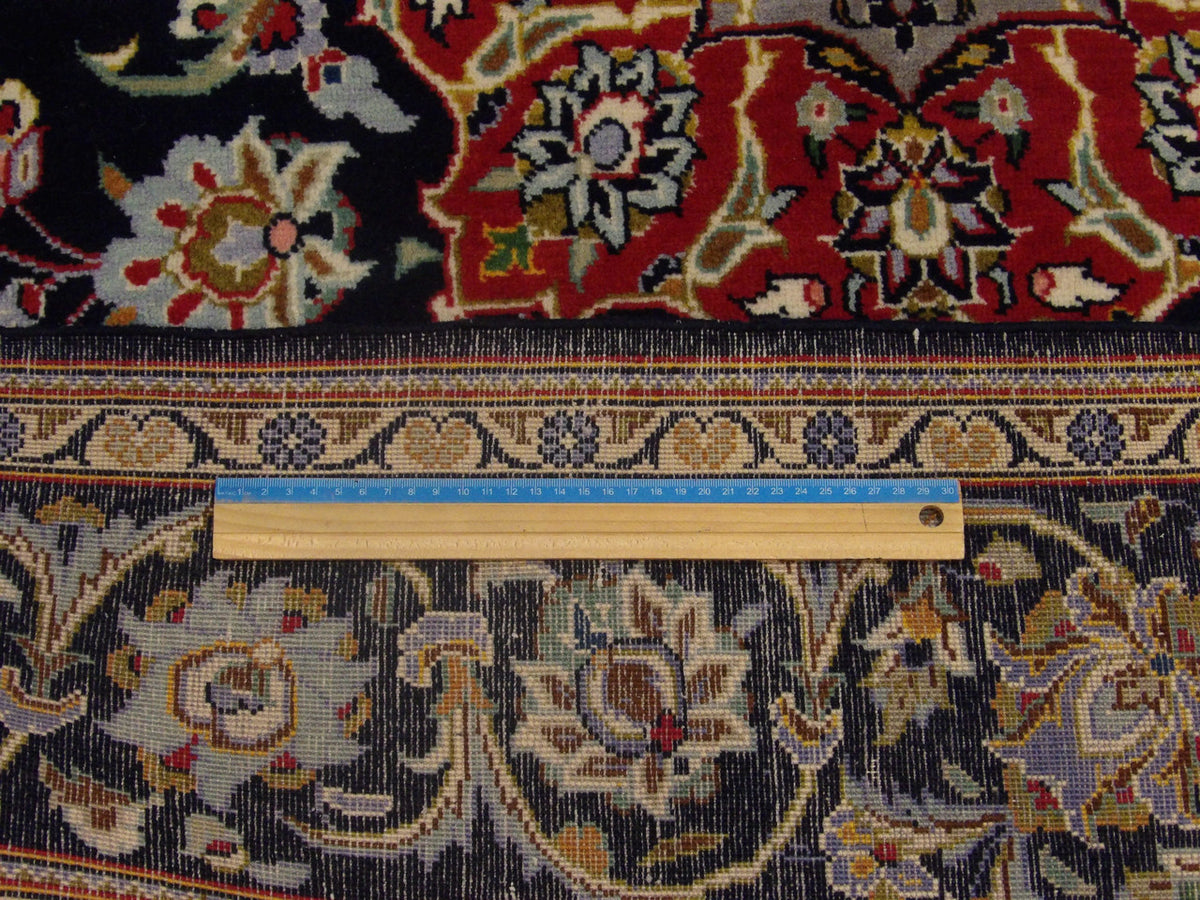 Blue Fine Persian Qum rug in room setting
