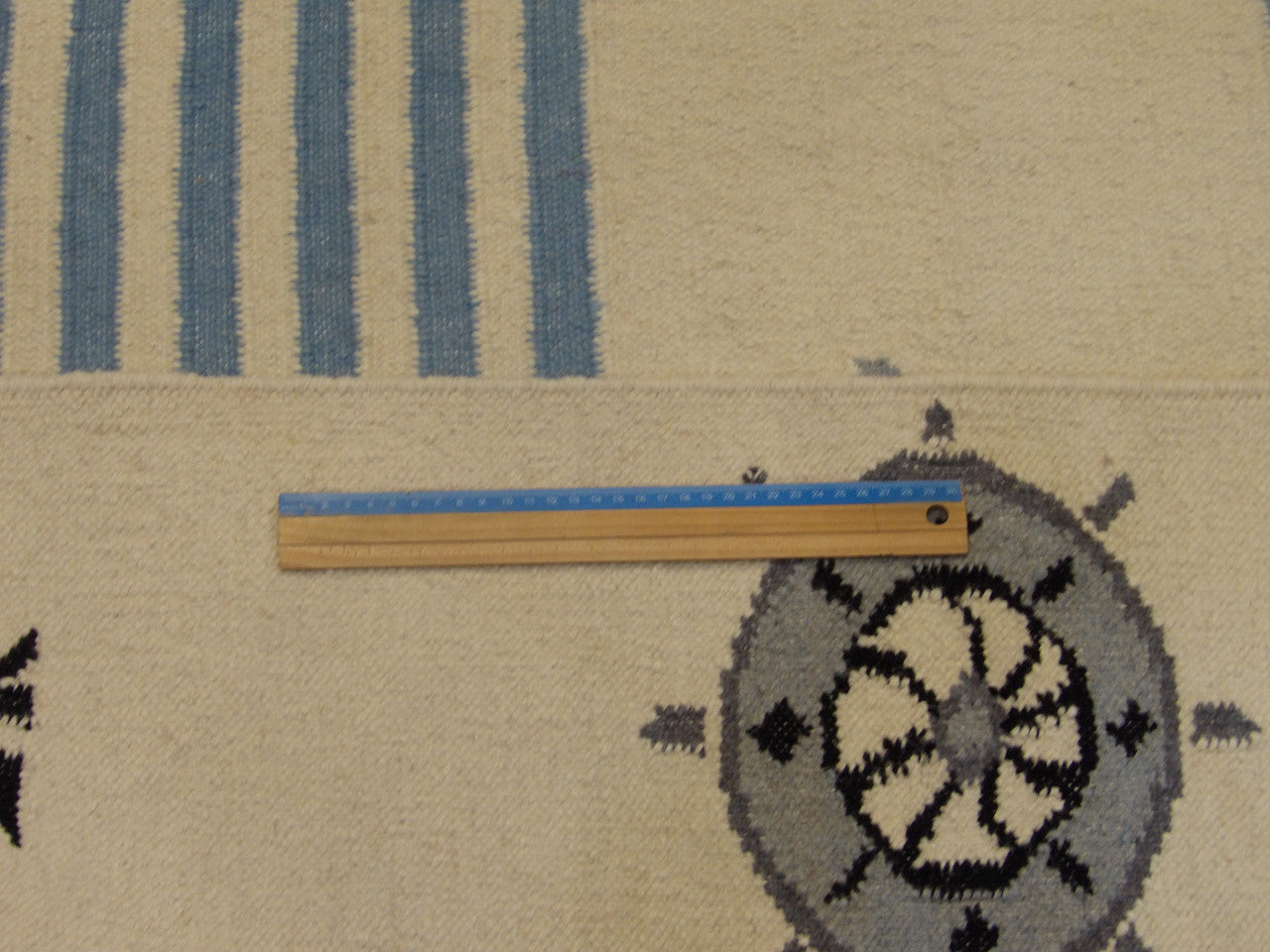 Full room view of coastal flat weave hand-knotted rug