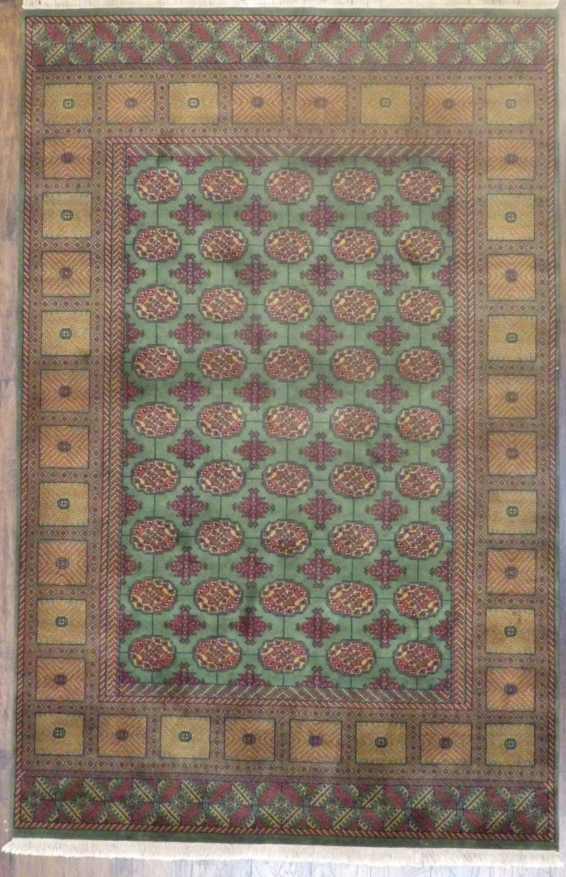 Tribal Bokhara Elephant Foot Design hand-knotted wool rug in Gold & Green, full view