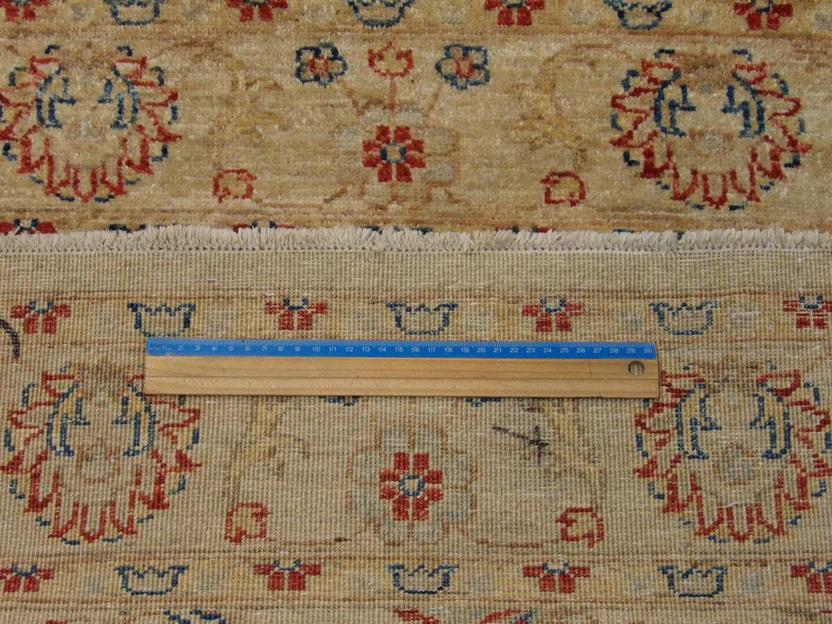 Beige Oushak Chobi rug in room setting