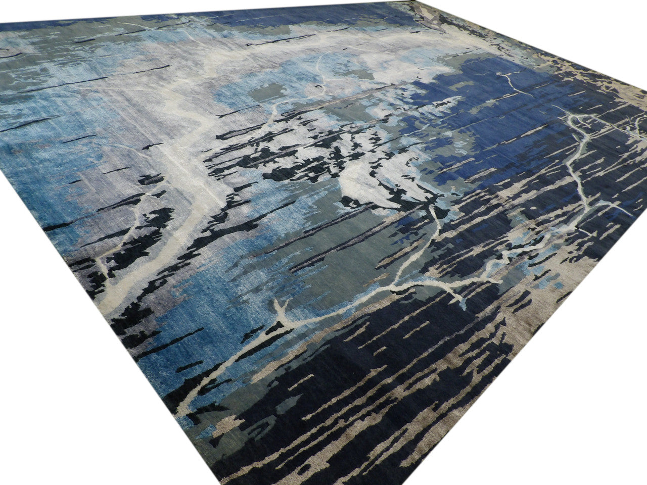 Monsoon abstract pattern detail, blue and gray wool-silk rug