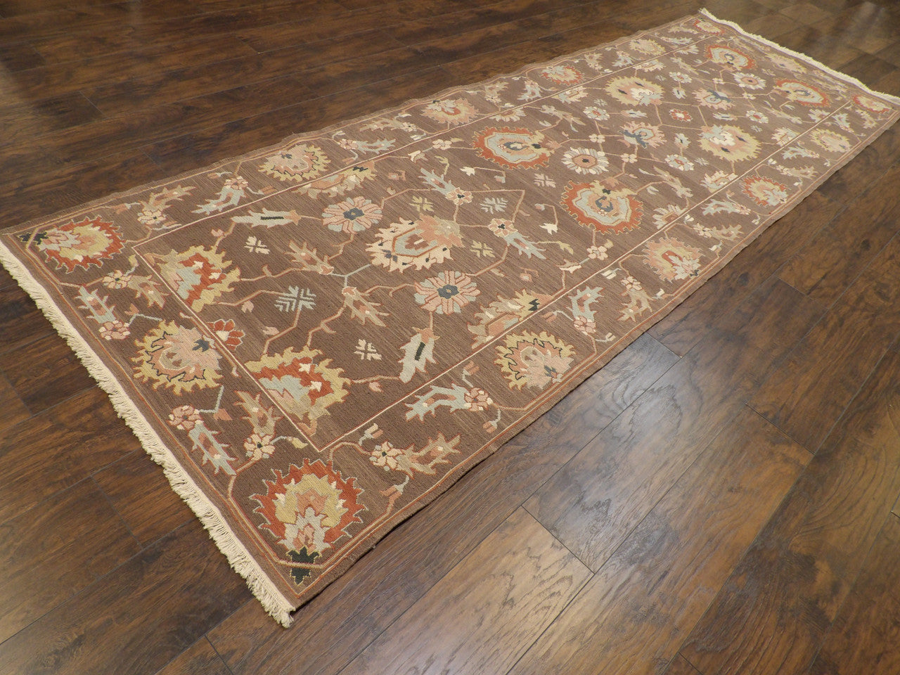 Brown Soumak flatweave runner in a hallway setting