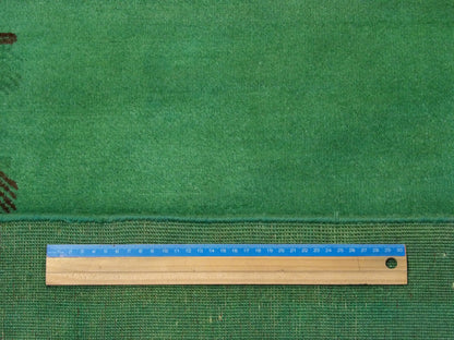 Green Overdye Gabbeh rug in room setting