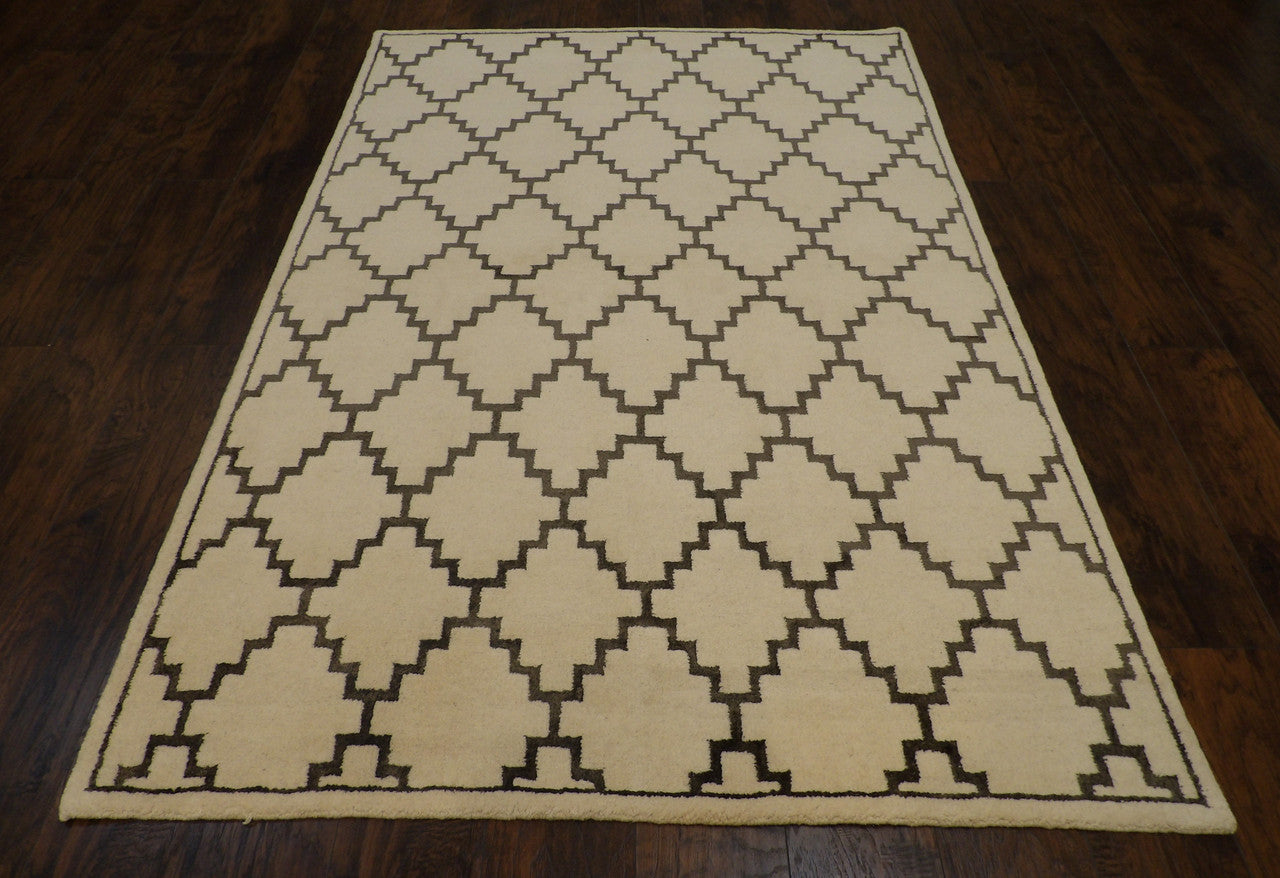 Close-up of wool pile, gray and ivory rug