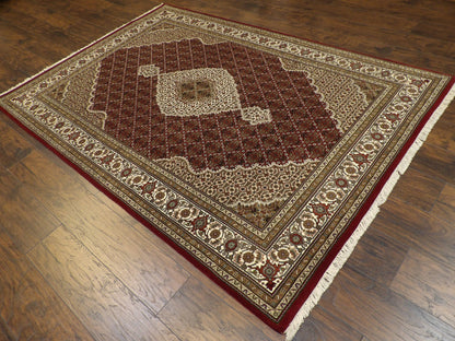 Red Persian Tabriz rug in a formal room setting