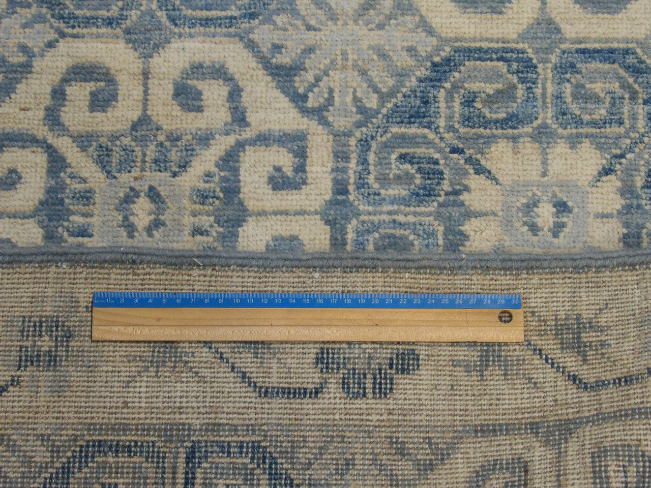 Blue & Beige Tribal Khotan rug in room setting