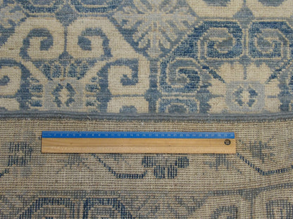 Blue & Beige Tribal Khotan rug in room setting