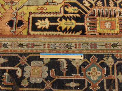 Full room view of oversized tribal Heriz hand-knotted rug