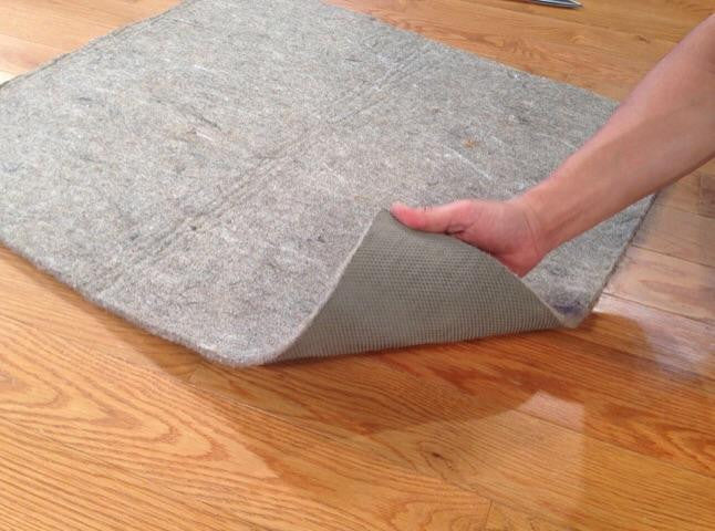 Premium non-slip felt rug pad, custom cut to fit, gray basket-weave backing