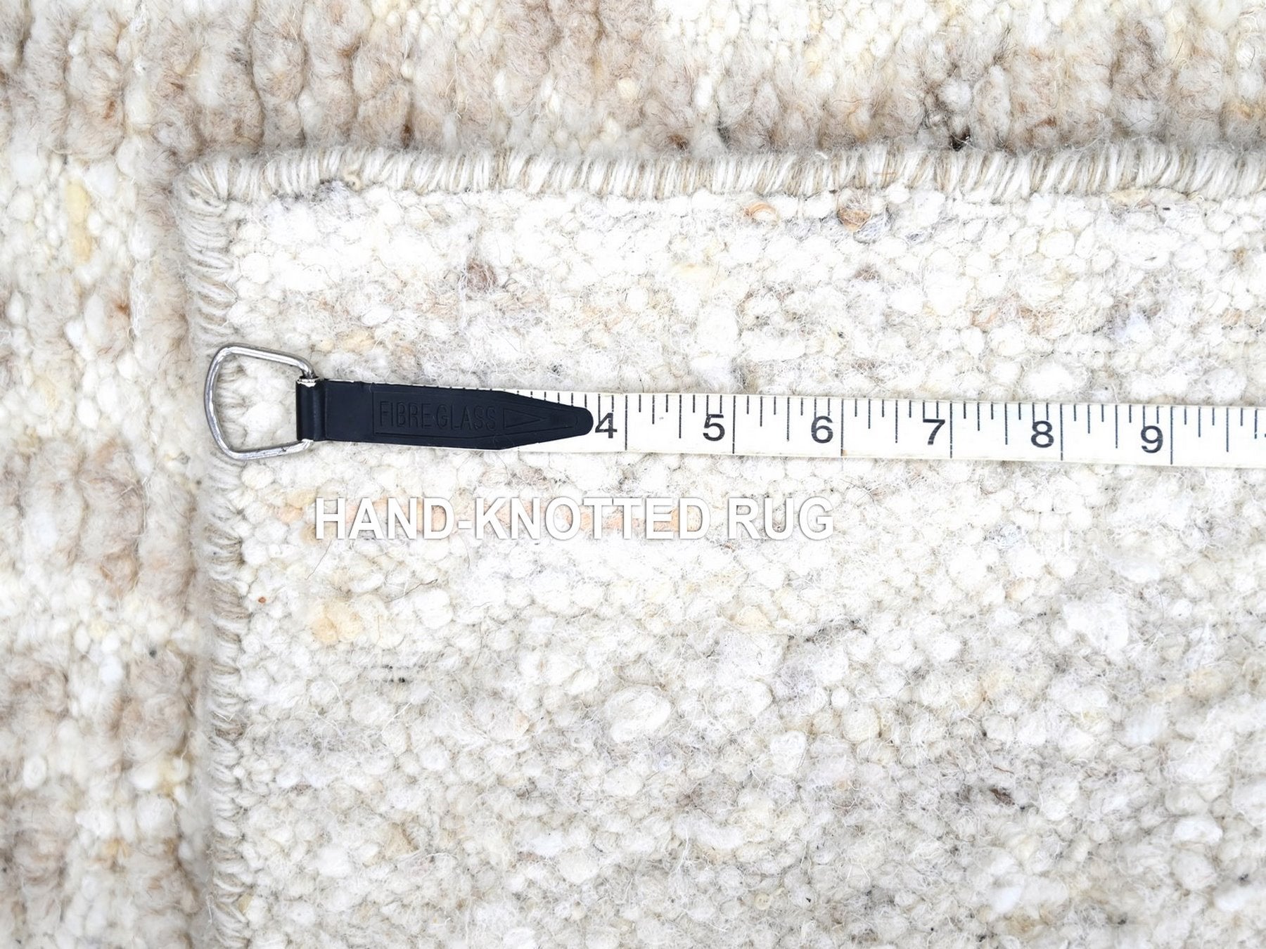 Modern / Contemporary hand-knotted wool rug in Ivory, 1'11" x 2'11" — SKU O010344 (view 7)