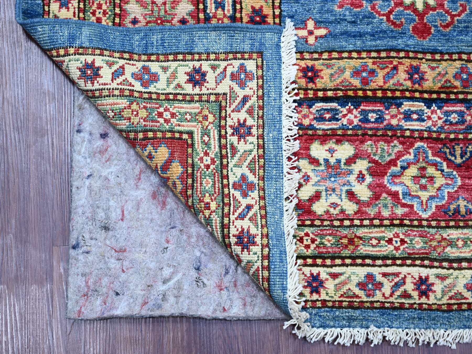 Kazak Tribal & Geometric hand-knotted wool rug in Blue & Red, 6'2" x 8'10" — SKU O021410 (view 2)