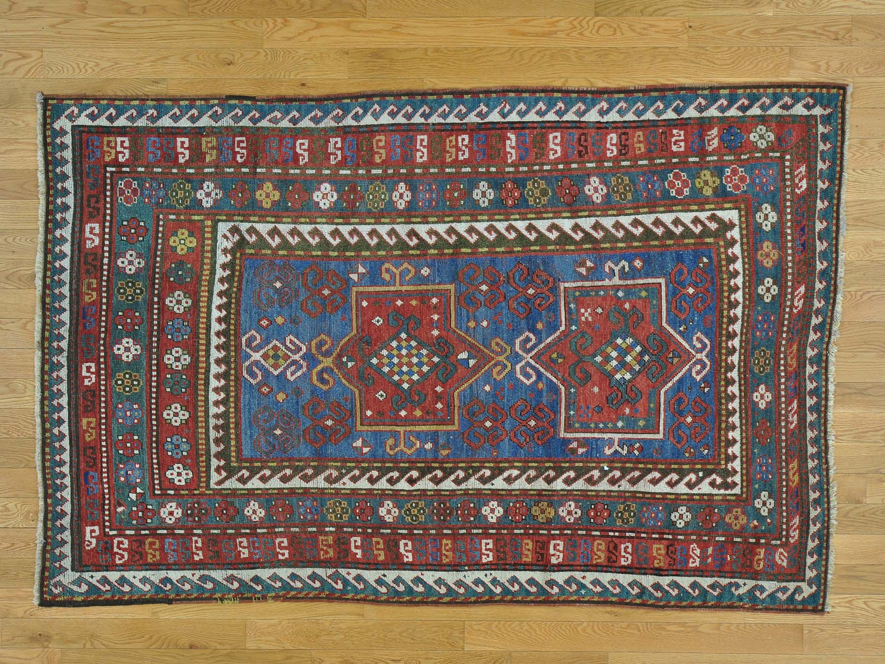 Antique hand-knotted wool rug in Blue & Red, 4'8" x 7'2" — SKU O028231