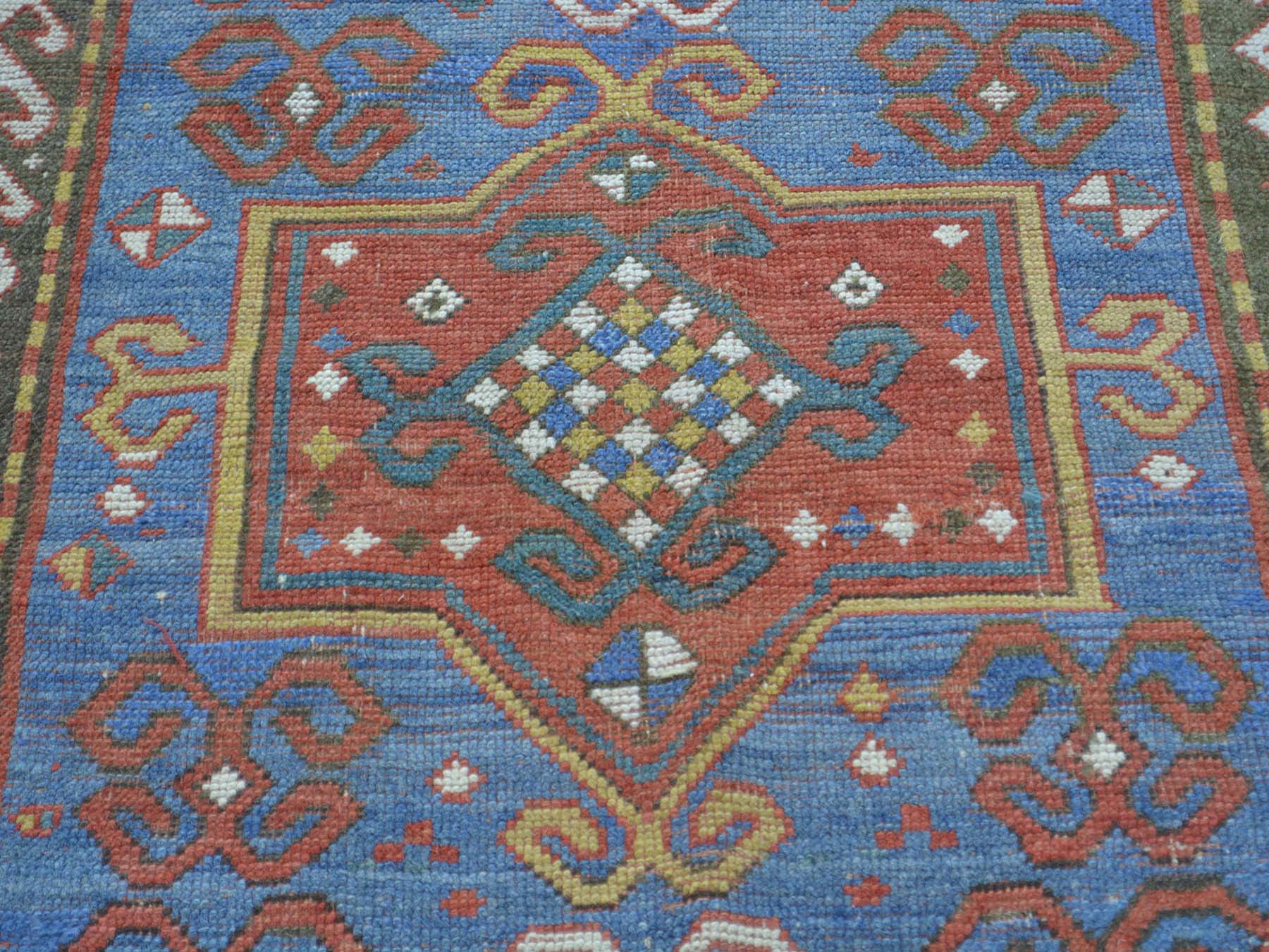 Antique hand-knotted wool rug in Blue & Red, 4'8" x 7'2" — SKU O028231 (view 4)