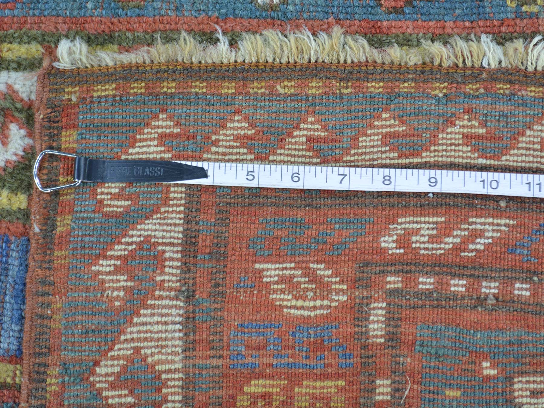 Antique hand-knotted wool rug in Blue & Red, 4'8" x 7'2" — SKU O028231 (view 5)