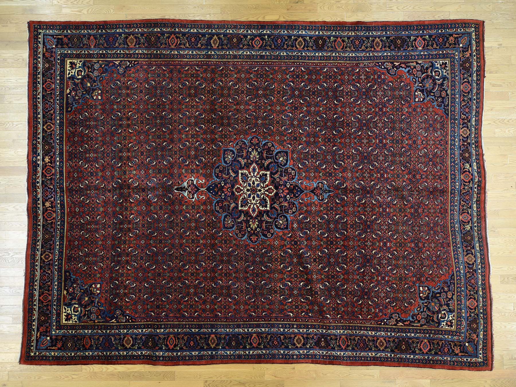 Antique hand-knotted wool rug in Red & Navy Blue, 10'5" x 13'9" — SKU O032840