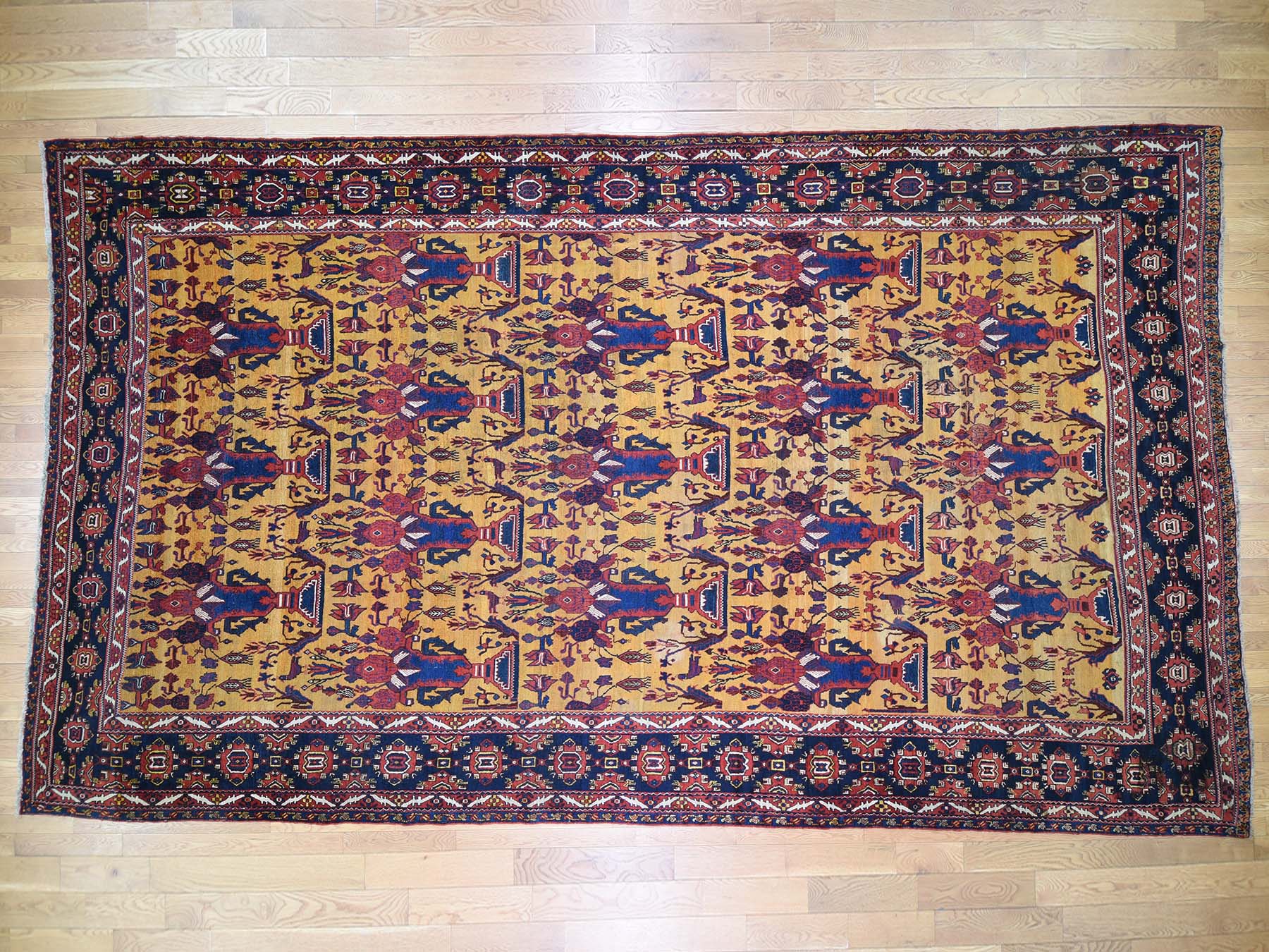 Bakhtiari Antique hand-knotted wool rug in Yellow & Navy Blue, 10'4" x 17'7" — SKU O044872