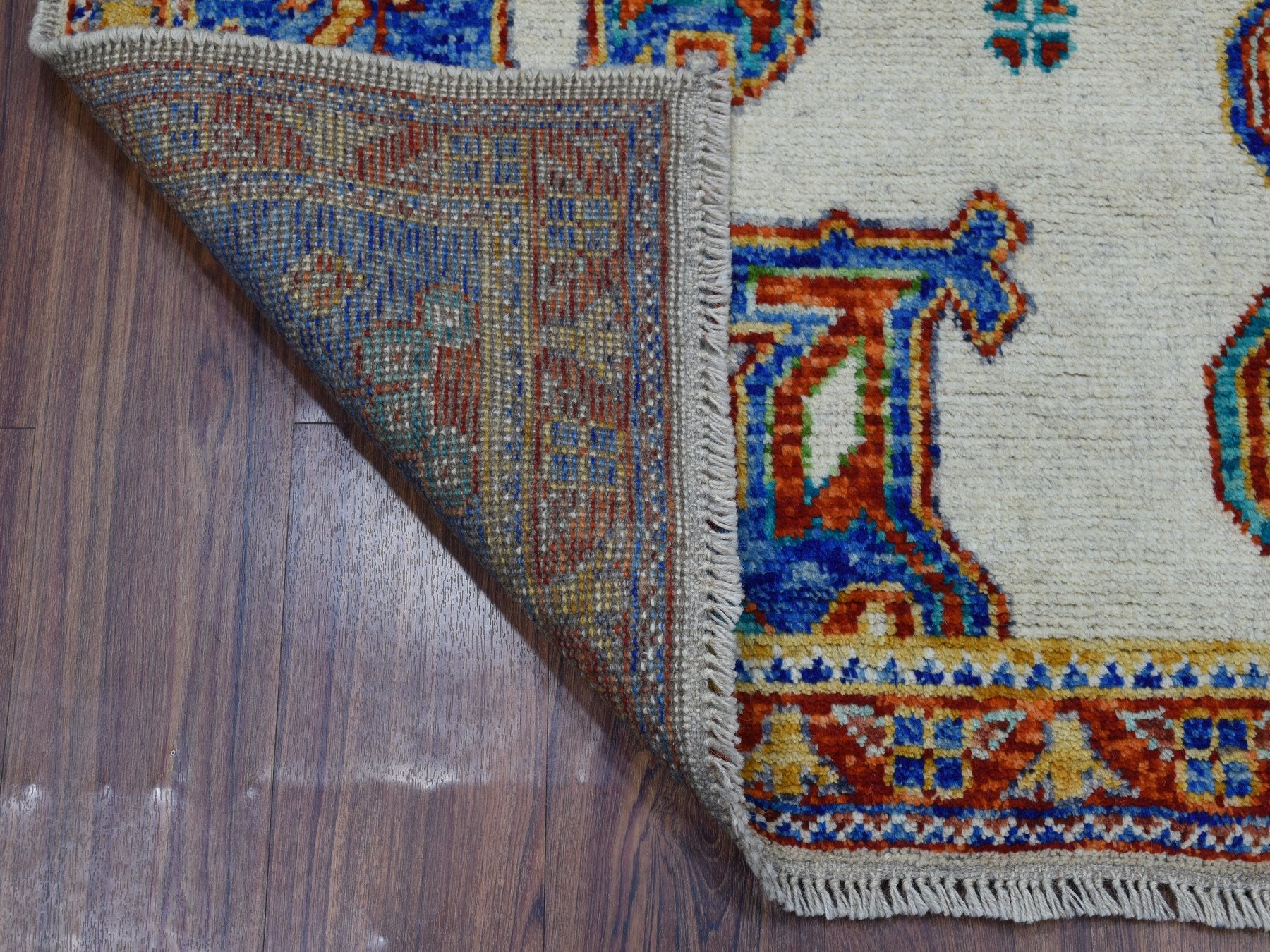 Baluch Tribal & Geometric hand-knotted wool rug in Ivory & Red, 5' x 6'7" — SKU O053337 (view 2)