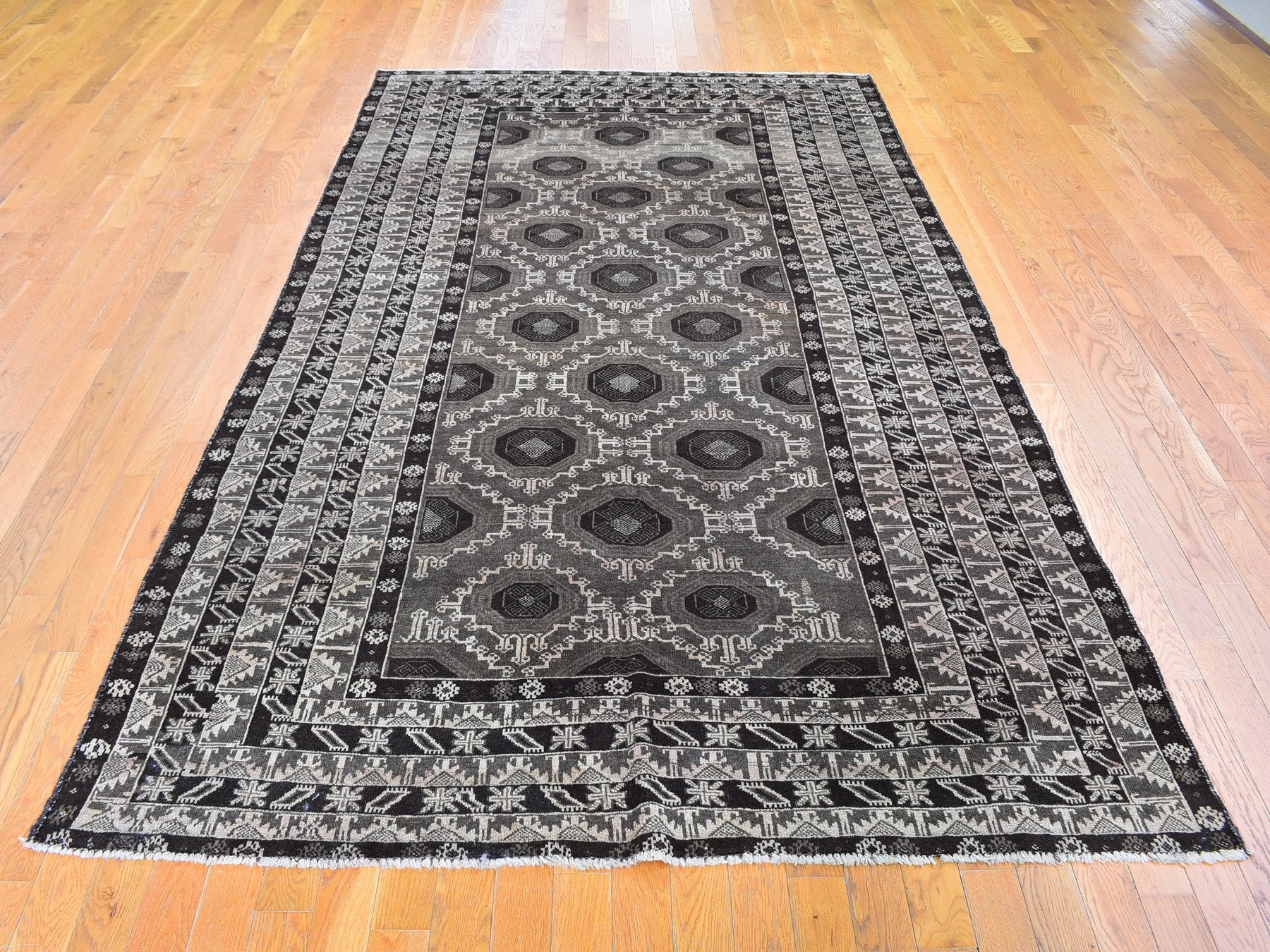 Baluch Tribal & Geometric hand-knotted wool rug in Brown, 5'8" x 9'10" — SKU O059564 (view 2)