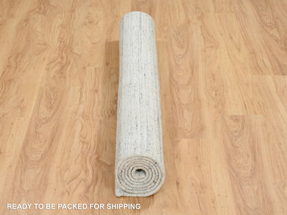 Ivory 5'0" x 7'0" Modern and Contemporary Handloom Wool Rug - Sku: O064779