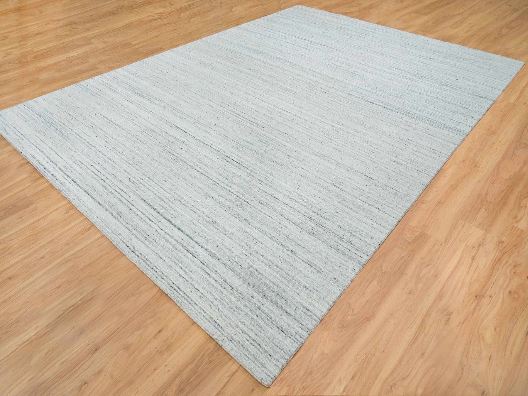 Modern / Contemporary hand-knotted wool rug in Ivory, 10'1" x 14'1" — SKU O065451 (view 3)
