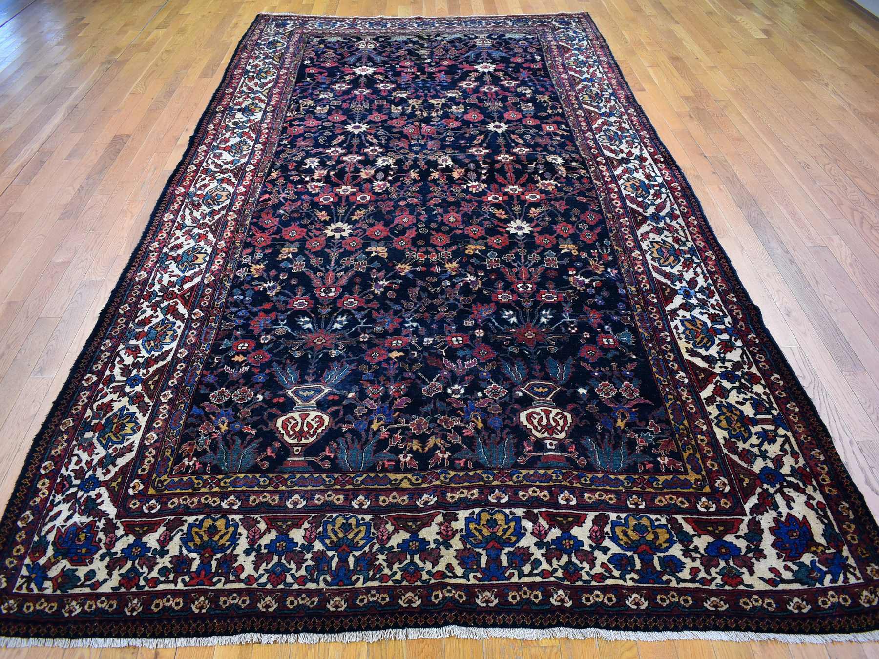 Antique hand-knotted wool rug in Blue & Ivory, 7'2" x 13'1" — SKU O066809 (view 2)
