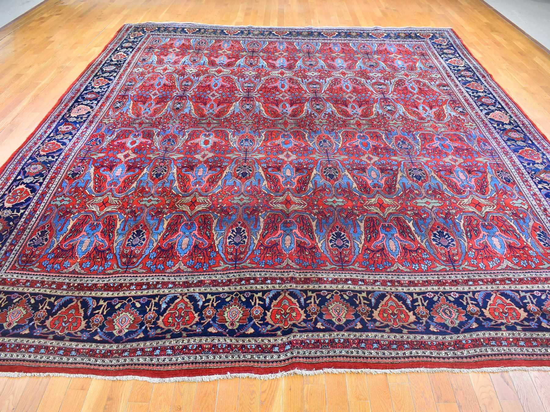 Antique hand-knotted wool rug in Red & Navy Blue, 12'5" x 13'9" — SKU O066865 (view 2)