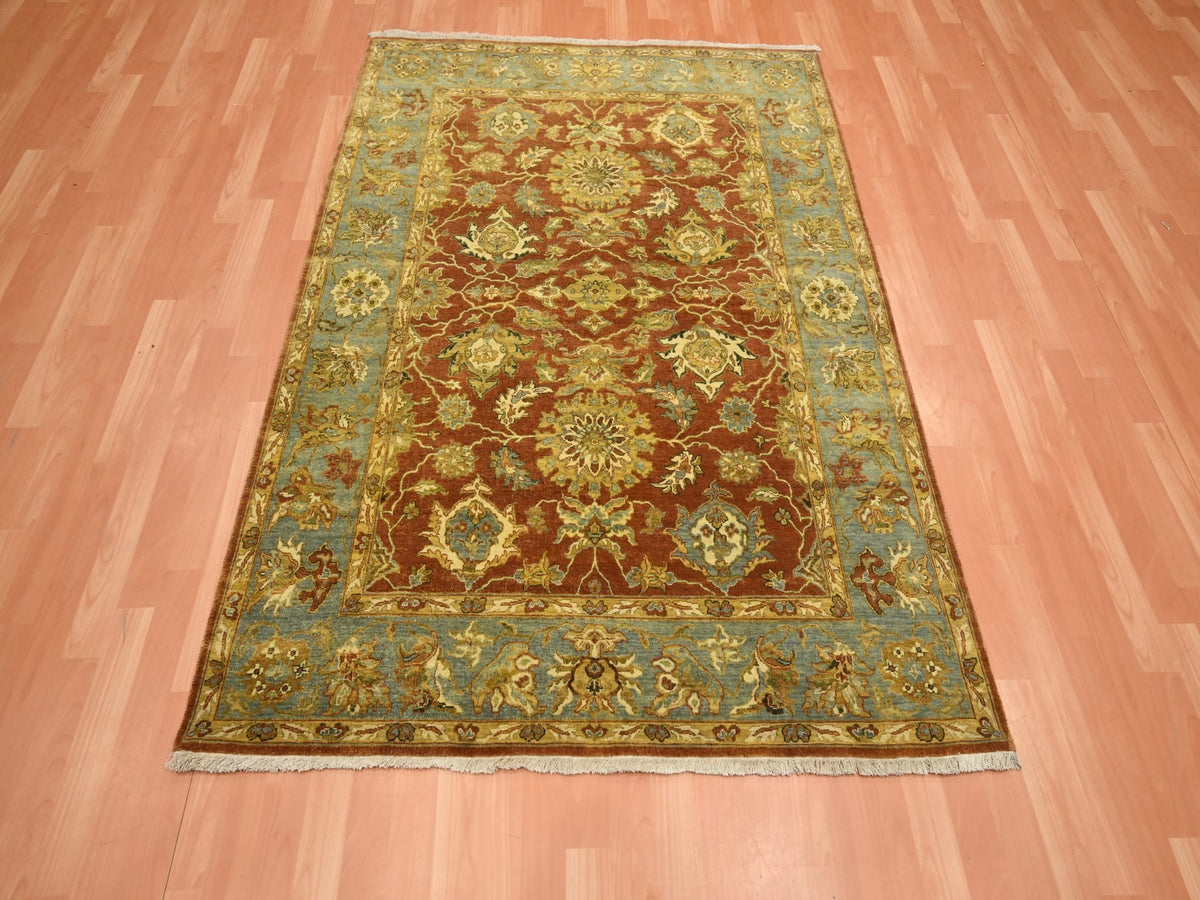 Fine Oriental hand-knotted wool rug in Red & Stone Blue, 4'8" x 6'4" — SKU O075650 (view 2)