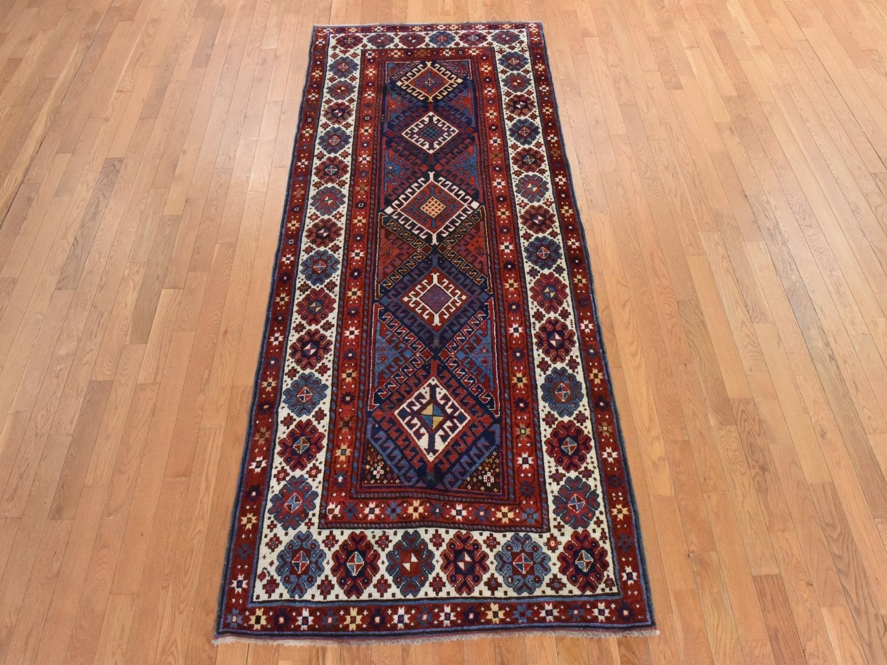 Kazak Antique hand-knotted wool runner in Red & Ivory, 4' x 9'4" — SKU O078451 (view 2)