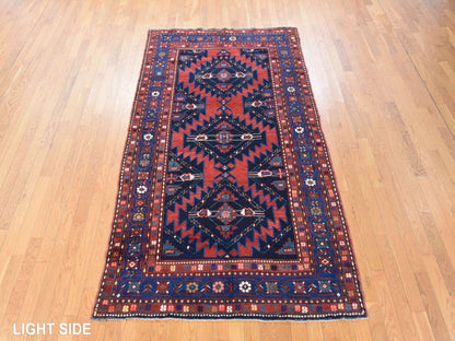 Antique hand-knotted wool rug in Red & Navy Blue, 5' x 8'6" — SKU O078487 (view 3)