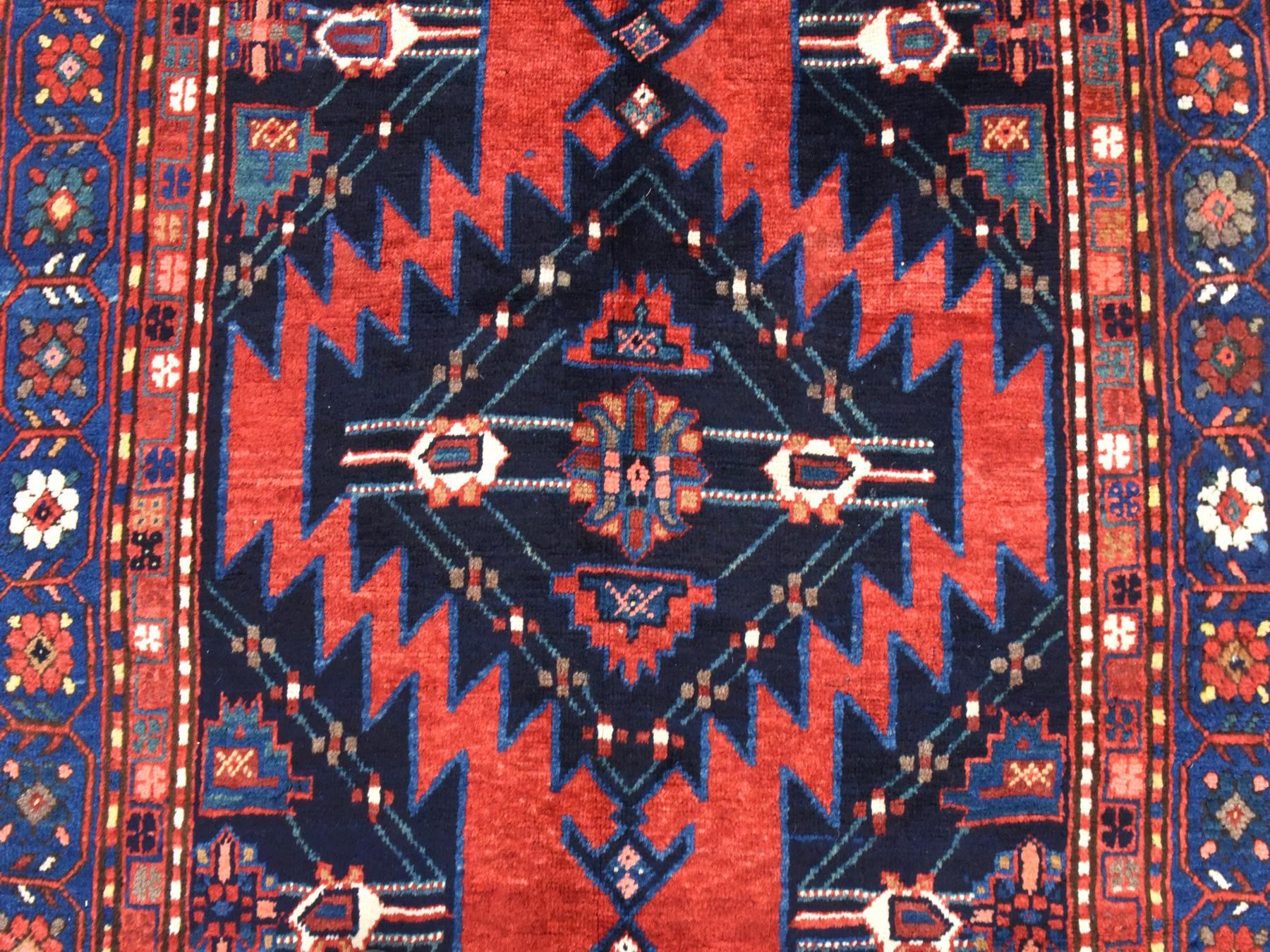 Antique hand-knotted wool rug in Red & Navy Blue, 5' x 8'6" — SKU O078487 (view 4)