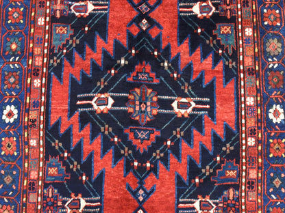 Antique hand-knotted wool rug in Red & Navy Blue, 5' x 8'6" — SKU O078487 (view 4)