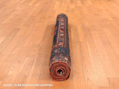 Antique hand-knotted wool rug in Red & Navy Blue, 5' x 8'6" — SKU O078487 (view 8)