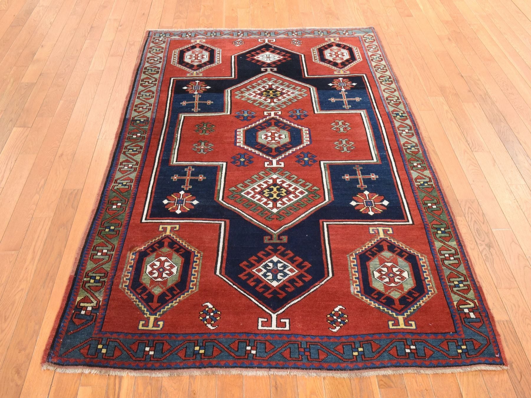 Kazak Antique hand-knotted wool rug in Red & Green, 4'9" x 7'1" — SKU O078531 (view 2)