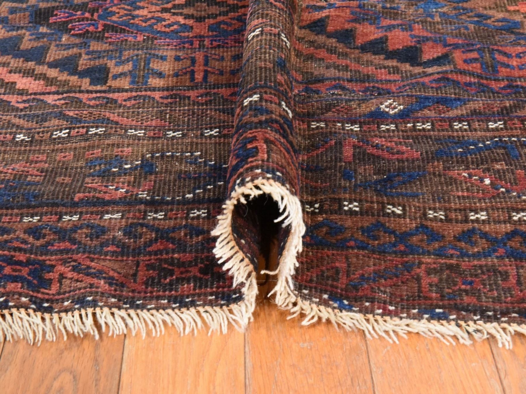 Antique hand-knotted wool rug in Red & Brown, 6'4" x 9' — SKU O078599 (view 9)