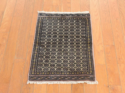 Tribal & Geometric hand-knotted wool rug in Ivory, 1'6" x 2'2" — SKU O078657 (view 2)