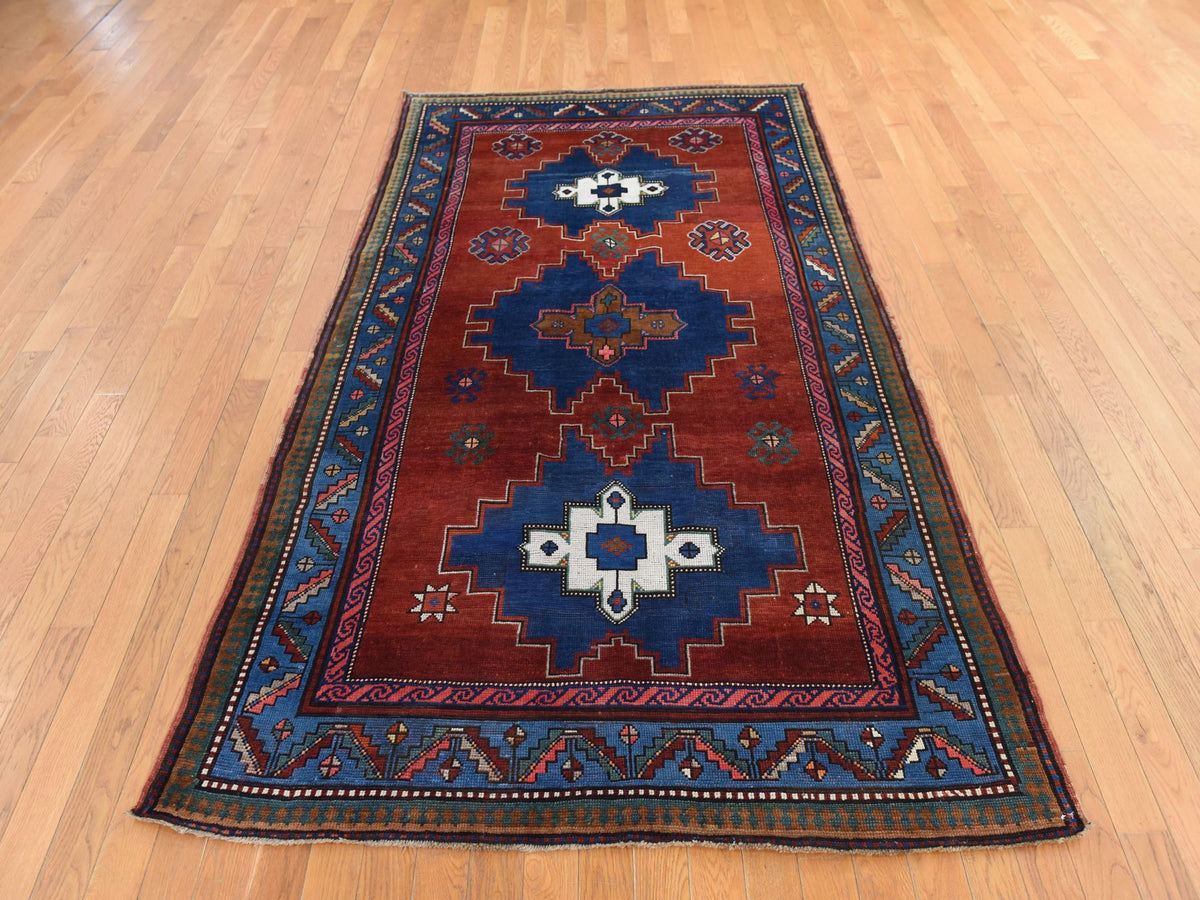 Kazak Antique hand-knotted wool rug in Red & Blue, 4'9" x 8'3" — SKU O078779 (view 2)