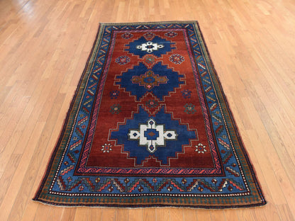 Kazak Antique hand-knotted wool rug in Red & Blue, 4'9" x 8'3" — SKU O078779 (view 2)