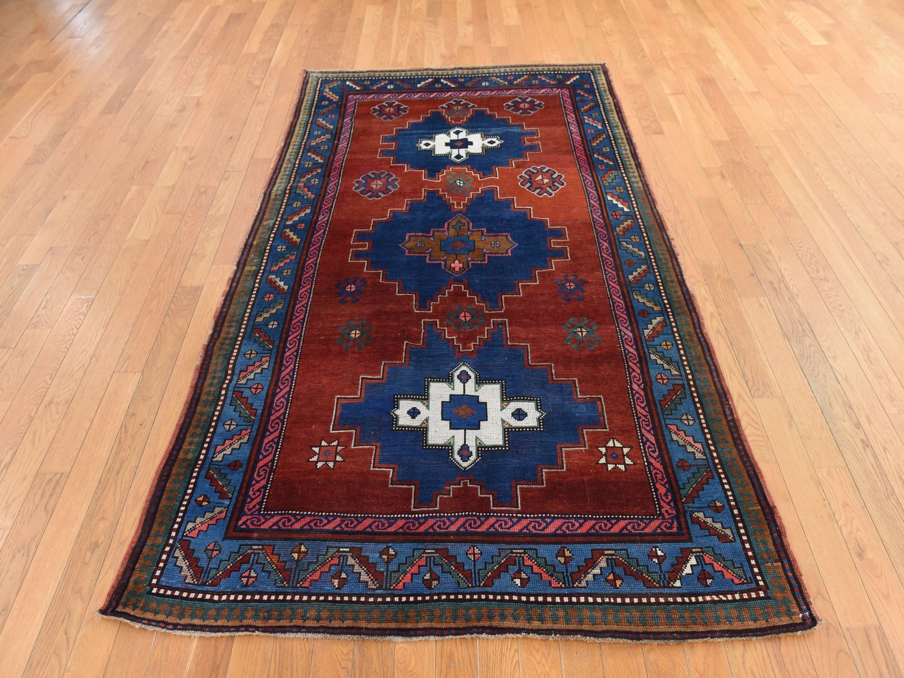 Kazak Antique hand-knotted wool rug in Red, 4'9" x 8'3", SKU O078779